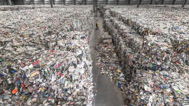 The recycling industry has been in crisis. A Derrimut warehouse where thousands of tonnes of waste has been left by SKM. Its owners want someone to help them remove it.