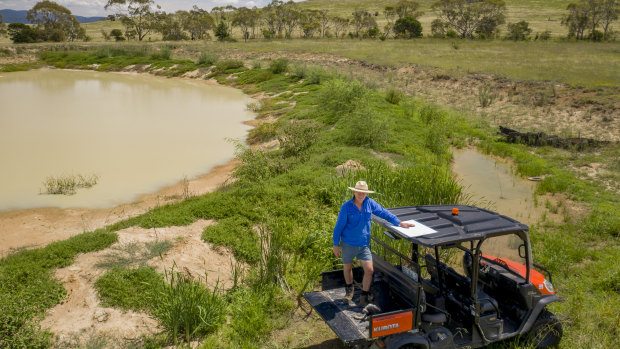 Braidwood farmer Martin Royds beside one of his first moated dams, which is starting to fill up.