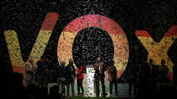 Santiago Abascal, the national president of Vox, centre, applauds during a rally of the far-right party in Madrid, Spain.