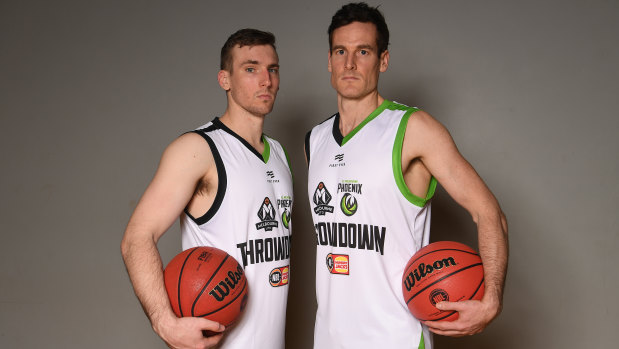 Melbourne United's Mitch McCarron (left) and South East Melbourne Phoenix's Ben Madgen at Thursday's launch of the new NBL season. 