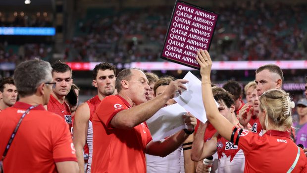 John Longmire speaks to his players at three quarter time