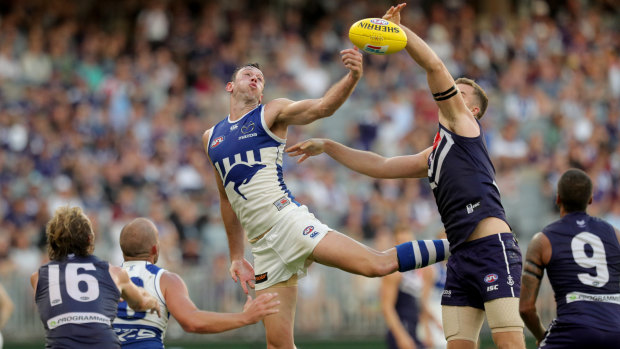 Hop to it: Kangaroo Todd Goldstein springs into a contest against Sean Darcy of the Dockers.