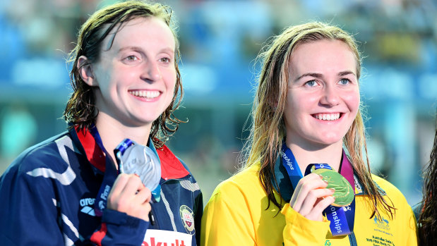Ariarne Titmus and Katie Ledecky show off their medals after the 400m final.