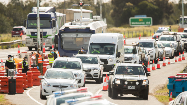 Ring of steel: Police stop cars heading into regional Victoria at Geelong.