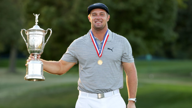 Major changes ... Bryson DeChambeau poses with the US Open trophy.