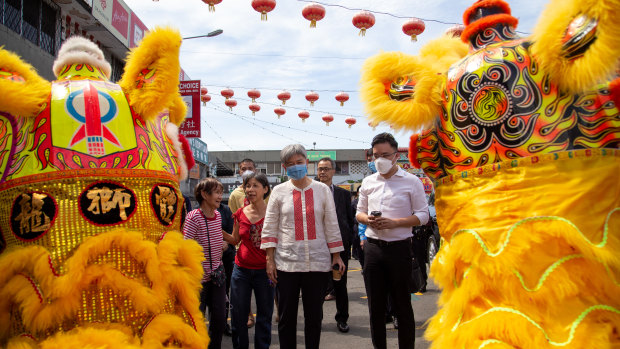 Australia’s foreign minister is welcomed by dragon dancers in Kota Kinabalu’s Chinatown area.
