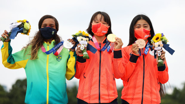 Rayssa Leal of Brazil and Momiji Nishiya and Funa Nakayama of Japan pose with their medals during the women’s street final medal ceremony.