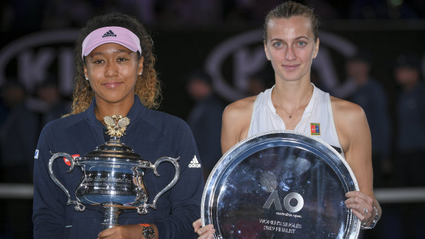 Champion Naomi Osaka and runner-up Petra Kvitova pose after their three-set final.