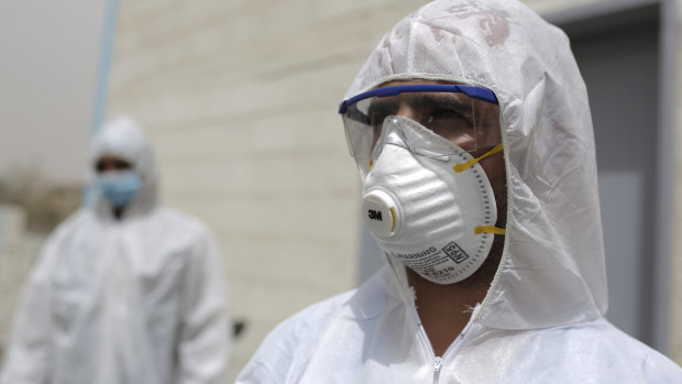 Medical staff set up a coronavirus quarantine ward at a hospital in Sanaa, Yemen.