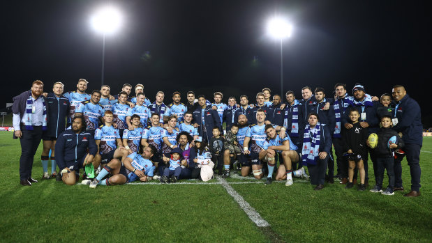 The Waratahs pose for a group shot after completing their winless season.