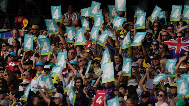 Cricket fans enjoy the show at a packed MCG.