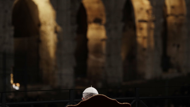 The pope in front of Rome's Colosseum.