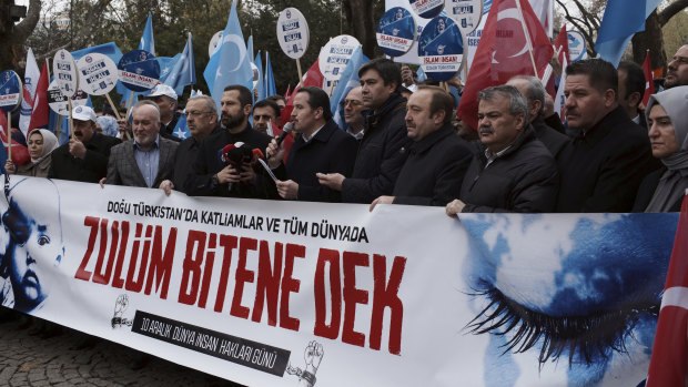 Turkish demonstrators in Ankara stage a protest demanding an end to mass detentions of Uighurs and other predominantly Muslim ethnic minorities in China.