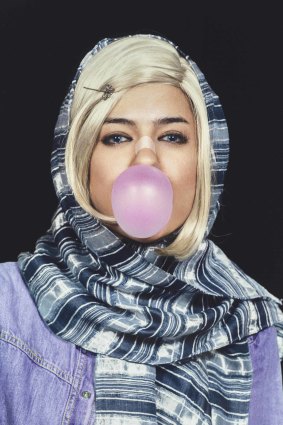 Shirin Aliabadi, the bandaged nose denotes plastic surgery, a status symbol among women in Iran. 