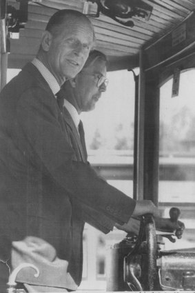 Prince Philip at the wheel of a 1909 tram in 1986.