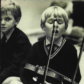 Richard Tognetti, aged six, at Pleasant Heights Public School, learnt violin by the Suzuki method. Here he is captured at a 1972 performance at the Conservatorium of Music.