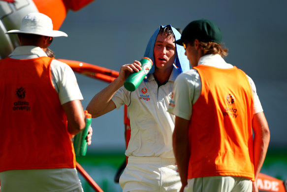 Australian batsman Marnus Labuschagne shielding from the heat at a Test match in Perth in December 2019.