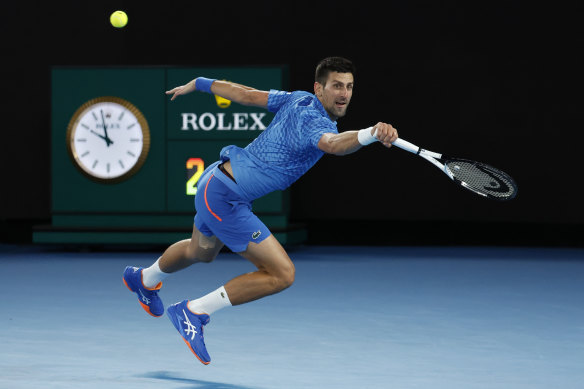 Novk Djokovic plays a backhand to Stefanos Tsitsipas in the men's singles final at the Australian Open.