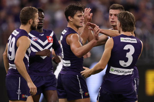 Lachie Schultz celebrates one of three goals in his side’s win over Carlton.