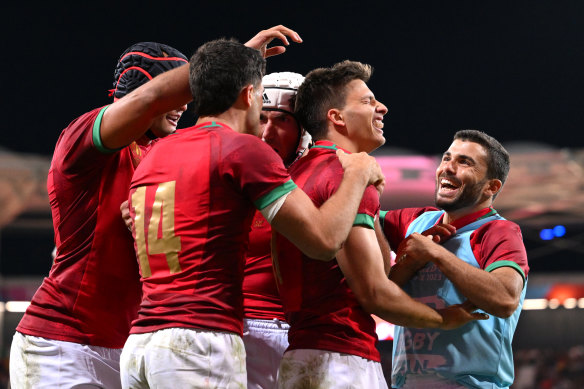 Portugal celebrate their first World Cup win.