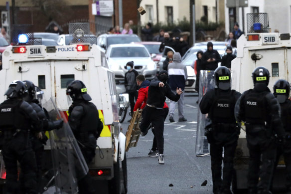 Nationalists from the mainly Catholic Springfield road area of West Belfast clash with police in Northern Ireland on Wednesday.
