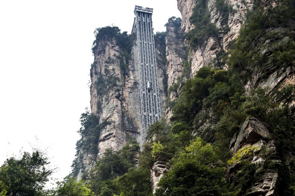 This glass double-deck elevator is built on to the side of a huge cliff.