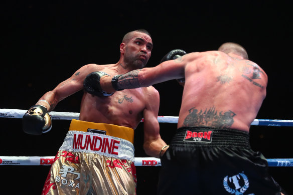 Mundine and John Wayne-Parr exchange blows.