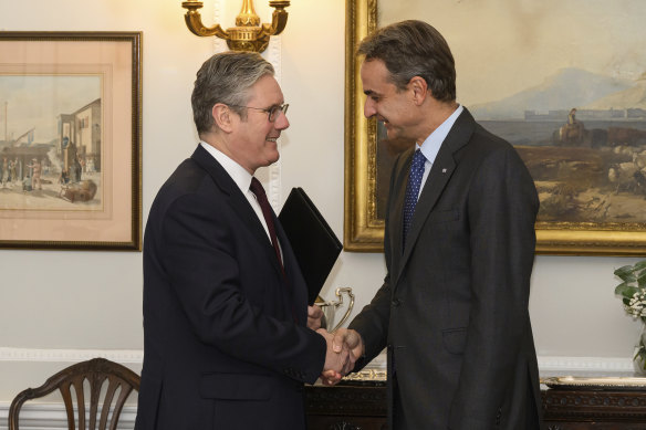 Britain’s Labour Party Leader Keir Starmer, left, meets with the Prime Minister of Greece Kyriakos Mitsotakis in London.
