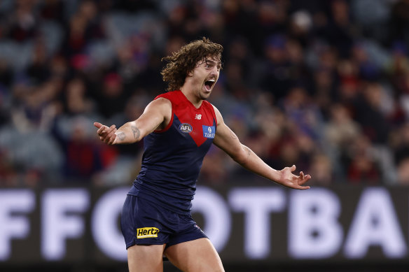 Jackson celebrates a goal during the round 15 match between the Demons and Lions in June. 