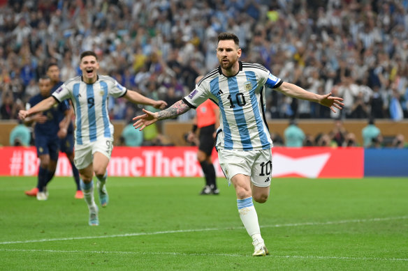 Lionel Messi celebrates scoring from the spot.