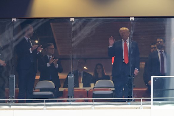President Donald Trump acknowledges the crowd at the memorial.