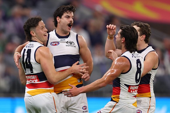Darcy Fogarty of the Crows celebrates a goal.