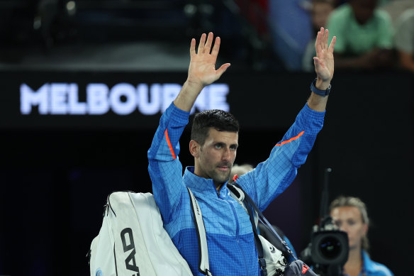 Novak Djokovic waves to the crowd after breezing past local hope Alex de Minaur.