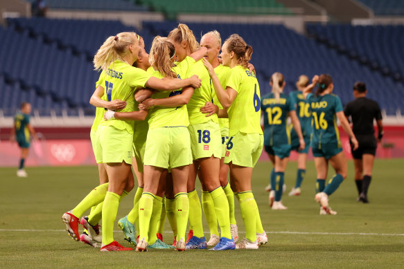 Sweden celebrate one of their four goals.