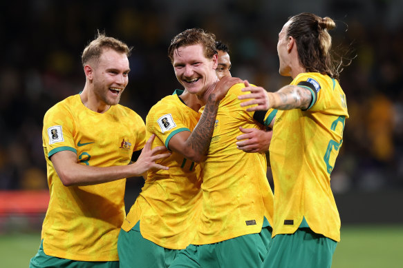 Kye Rowles celebrates his goal with the team.