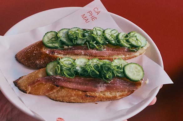 Anchovy toast with baby cucumbers and spring onion.