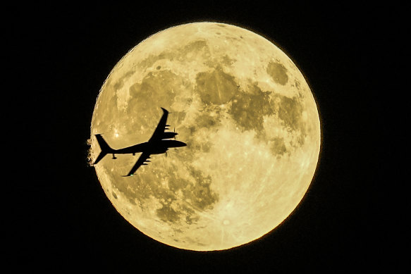 An unmanned aerial craft passing in front of a supermoon on Ankara Turkey.