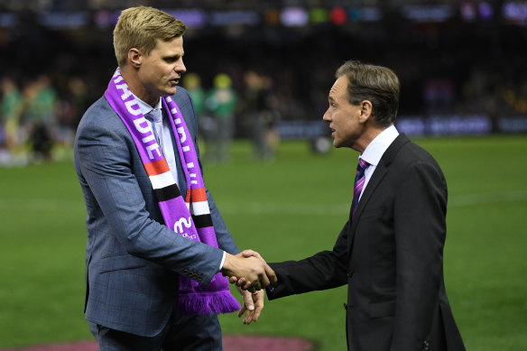 Former St Kilda player Nick Riewoldt  in 2018 with the then federal health minister, Greg Hunt, after Hunt announced a $1 million grant to Maddie Riewoldt’s Vision.