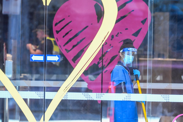 A cleaner mops the floor at the Novotel in Southbank on Friday.