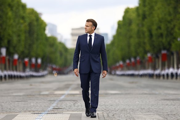 Emmanuel Macron arrives at the Bastille Day military parade on the Champs-Élysées in Paris on July 14.
