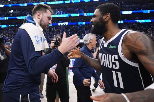 Mavericks superstars Luka Doncic and Kyrie Irving celebrate their win over the Minnesota Timberwolves during the play-offs.