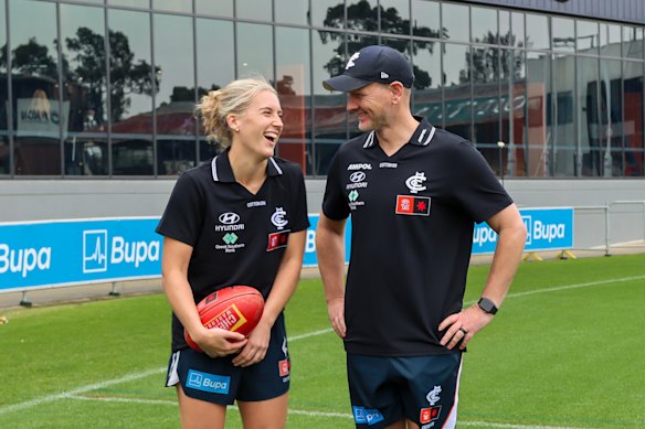 Carlton AFLW captain Abbie McKay and coach Mathew Buck.
