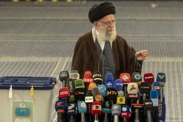 Supreme Leader of the Islamic Republic Ayatollah Ali Khamenei delivers a speech after casting his vote, urging people to vote and