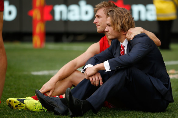 Brandon Jack (right) with his brother Kieren after the Swans lost the 2016 grand final.
