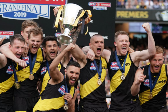 Richmond hold the AFL's 2019 trophy aloft.