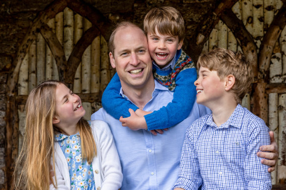 Prince William, Prince of Wales with his children Princess Charlotte, Prince Louis and Prince George (right)