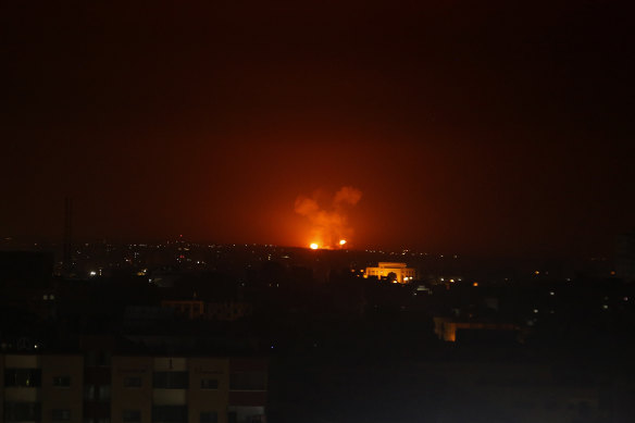 An explosion caused by Israeli air strikes in Gaza City early on Monday.