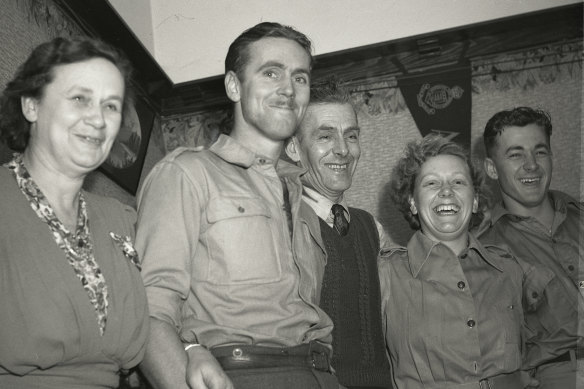 Private J. Burt of Croydon (second from left) is reunited with his family on October 24, 1944.