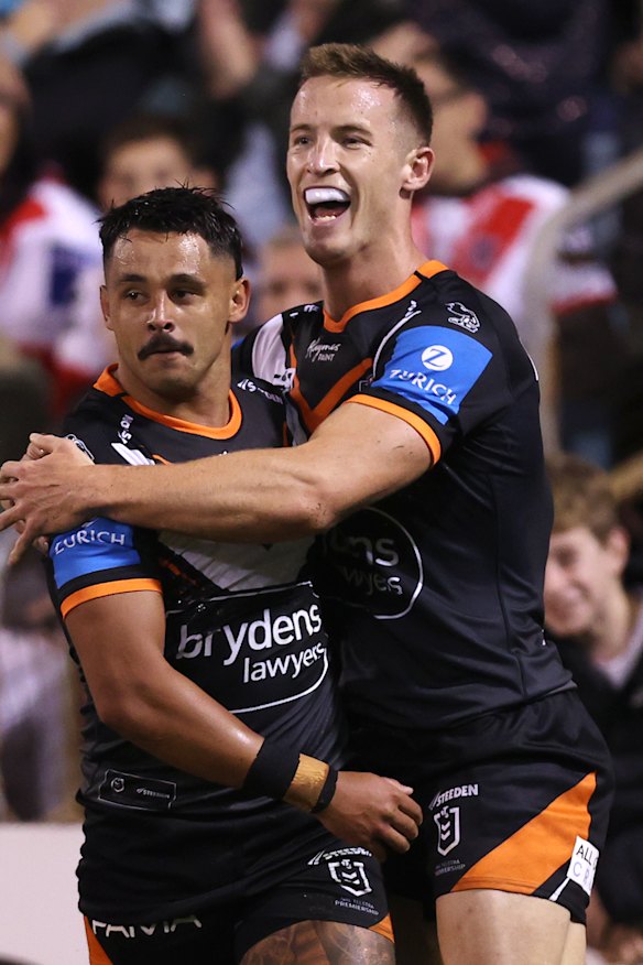 Jayden Sullivan and Alex Lobb celebrate a Tigers try against the Dragons last weekend.