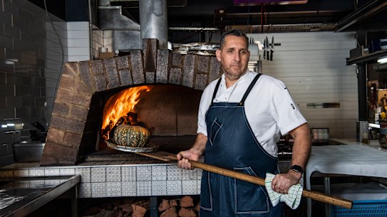 Restaurateur Attila Yilmaz struggles to pay his staff their full wage and still keep the restaurant open.